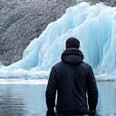Liam O'Connell standing by a glacier in Iceland.