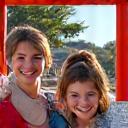 The Miller Family smiling in front of a traditional Japanese temple gate.
